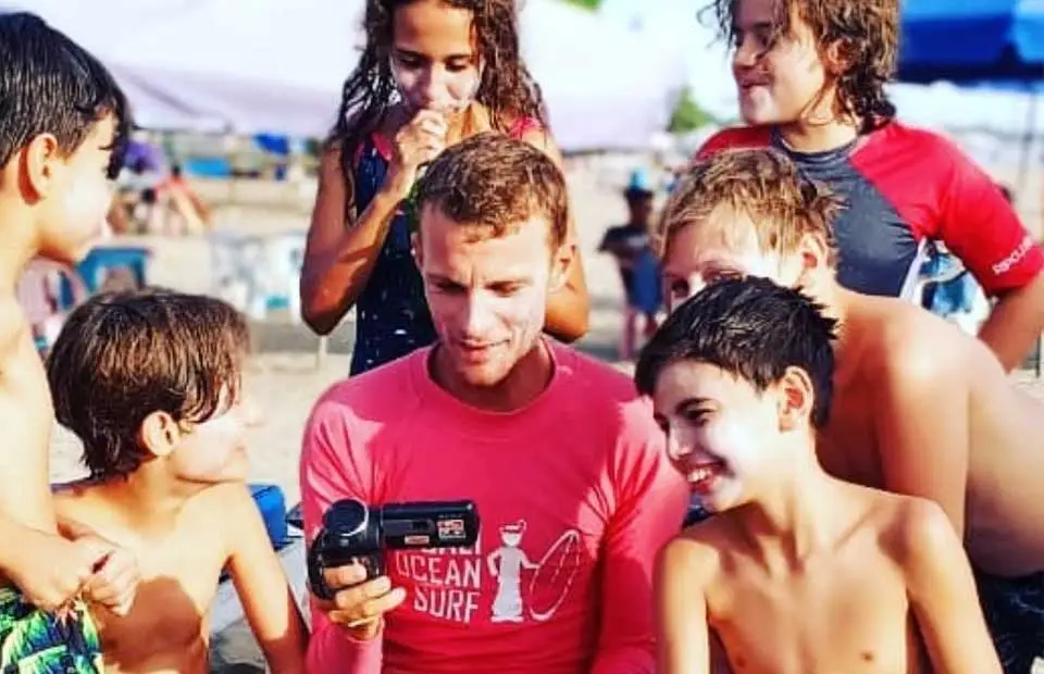 Instructor gives video feedback to Surf Club students